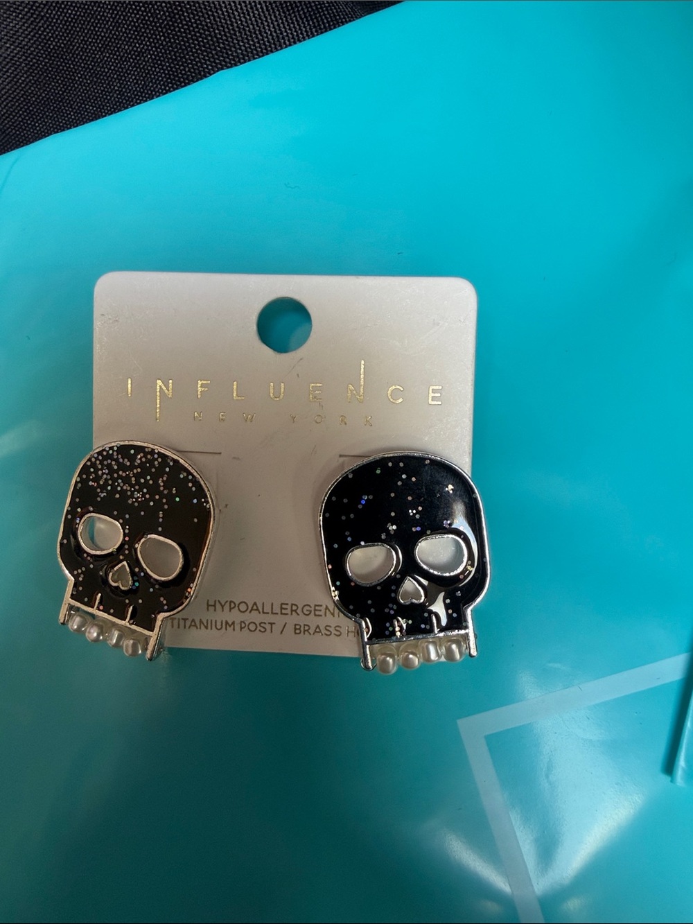 Skull earrings. Great for Halloween. Black and silver with sparkle in the black.